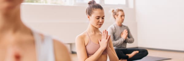 Woman meditating and feeling rejuvenated after her drip IV infusion